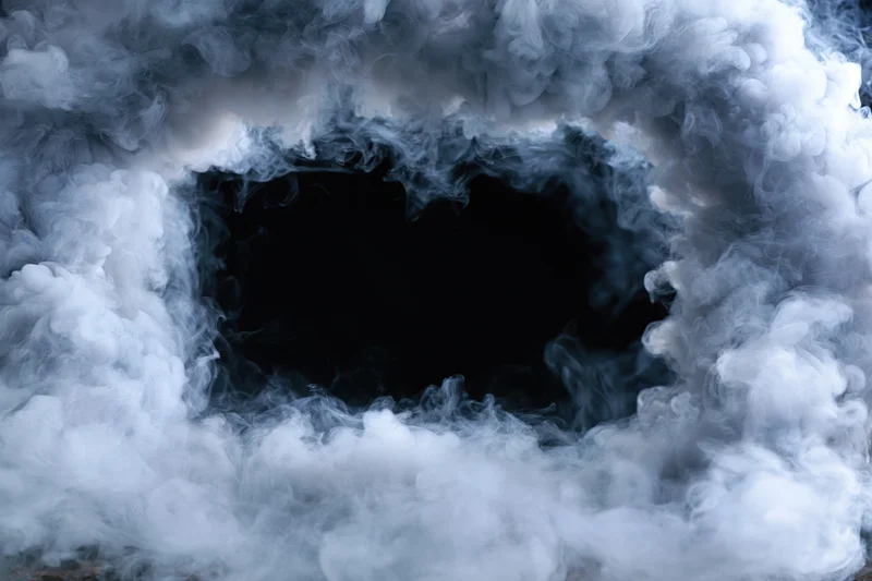 White smoke forming a rectangular frame around a dark void