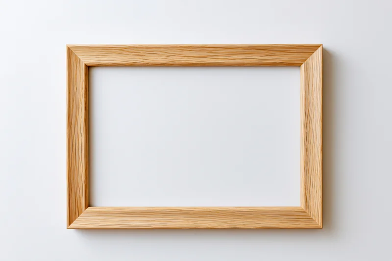 Light oak wooden picture frame hanging on a white wall with empty center for display