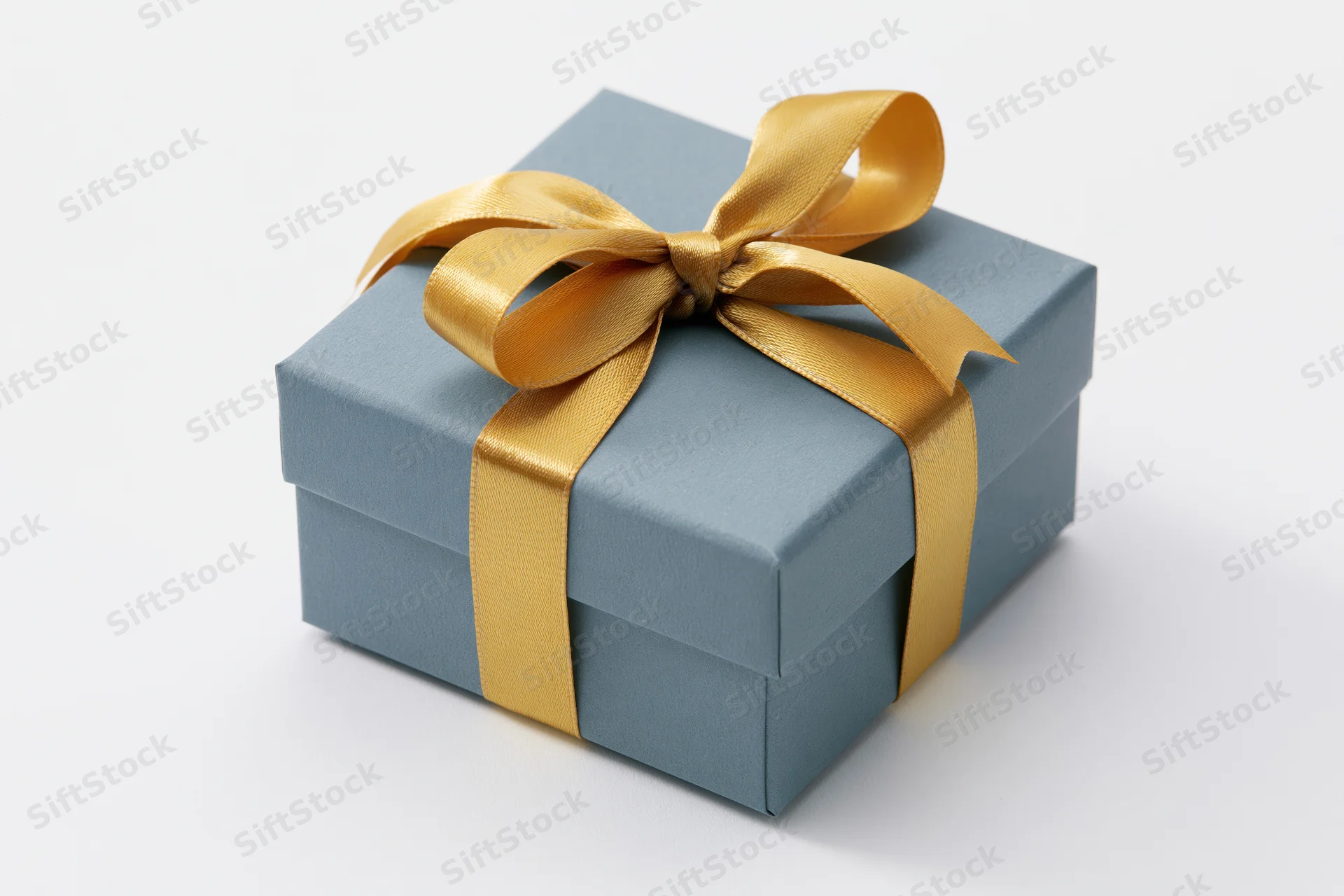 Blue gift box wrapped with gold ribbon on white background
