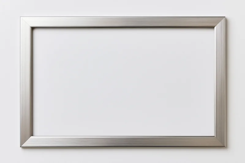 Silver metallic picture frame mounted on white wall with blank interior