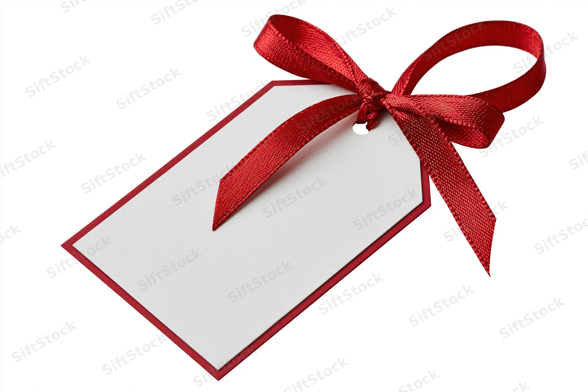 Blank white gift tag with red border and red ribbon bow on white background