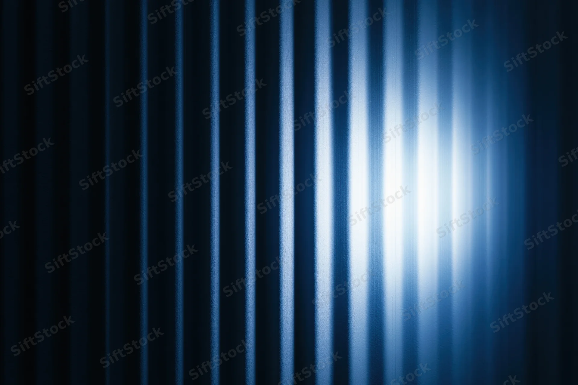 Vertical ridged panels with blue light gradient and metallic texture