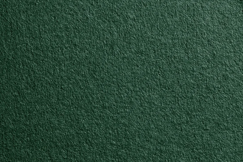 Close-up of dark forest green ribbed fabric texture filling the frame