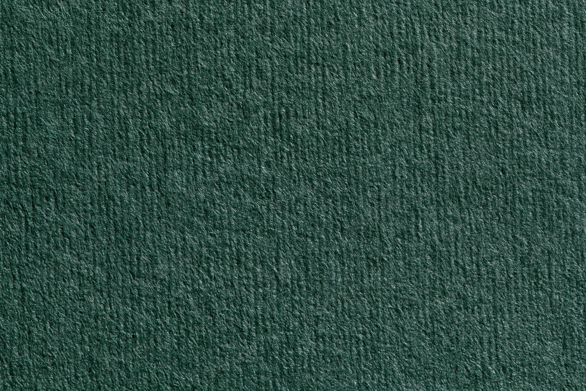 Close-up of dark forest green ribbed fabric texture filling the frame