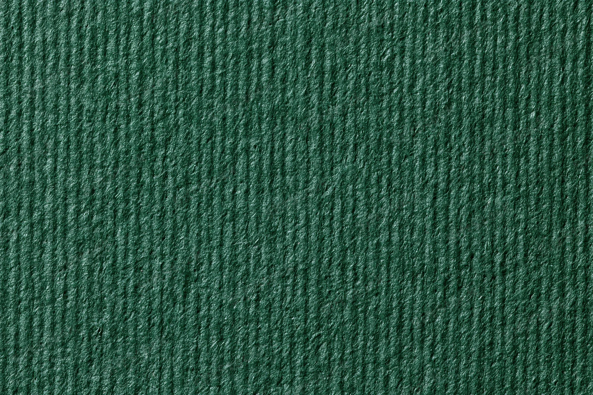 Close-up of dark forest green ribbed fabric texture filling the frame