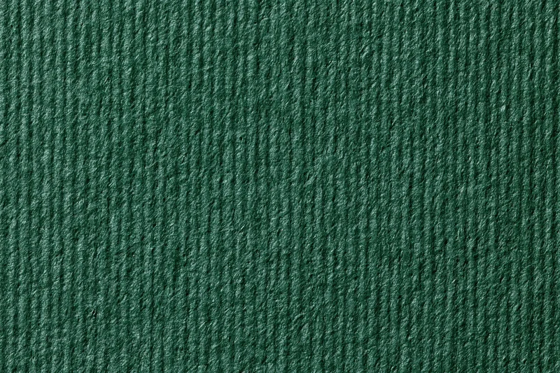 Close-up of dark forest green ribbed fabric texture filling the frame