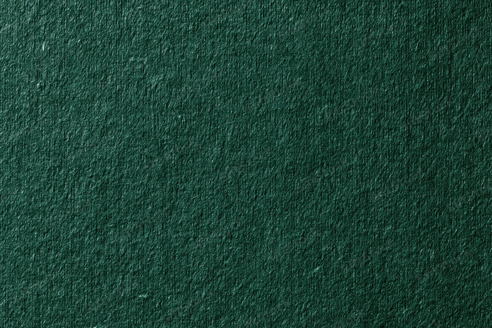 Close-up of dark forest green ribbed fabric texture