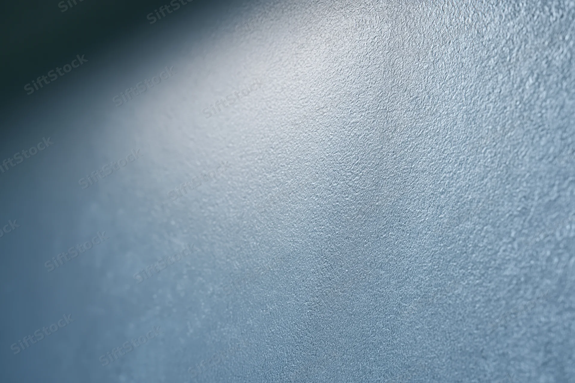 Close-up of frosted glass surface with fine texture and soft light gradient