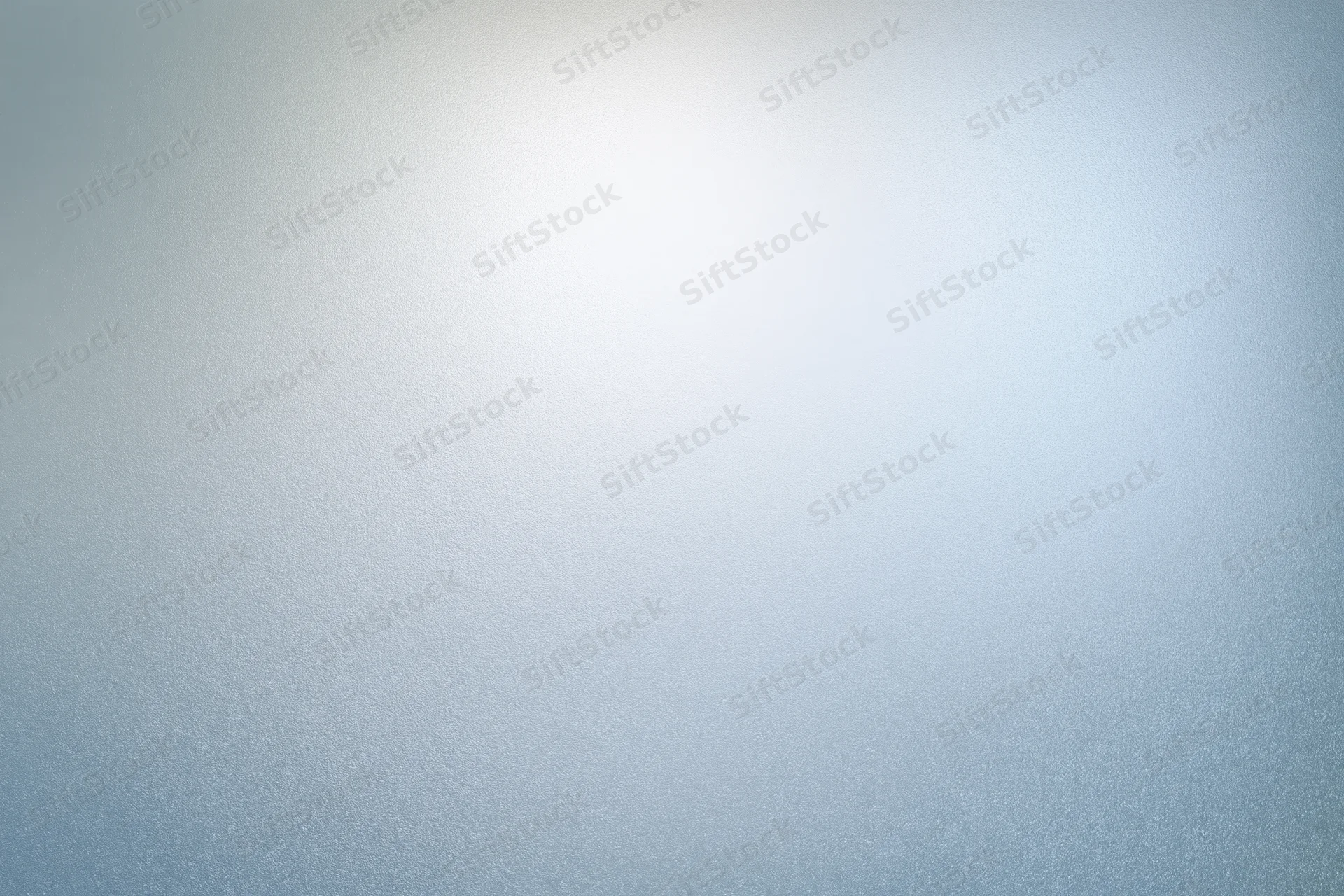 Frosted glass surface with soft light gradient and subtle texture filling the frame
