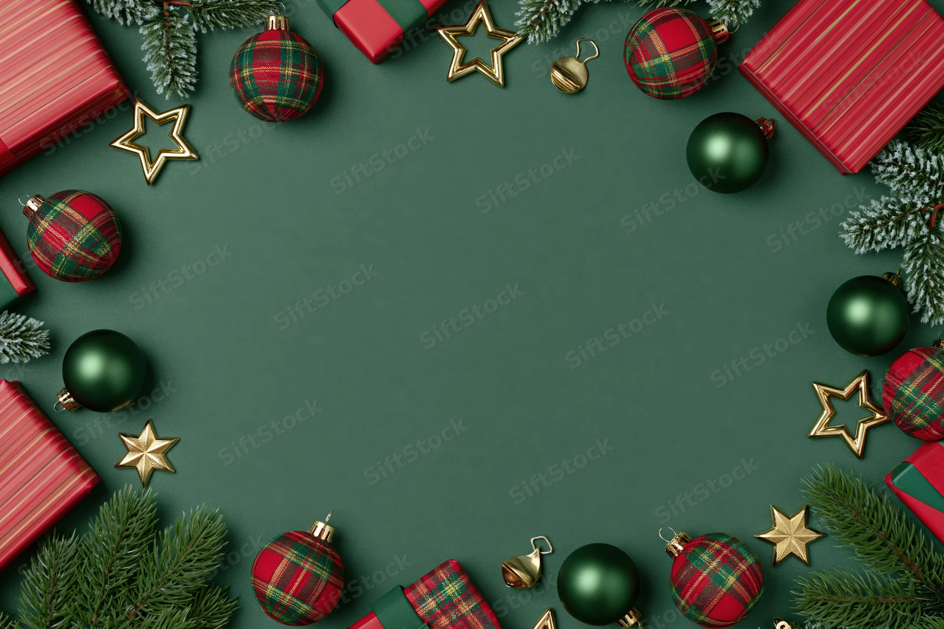 Christmas ornaments and wrapped gifts arranged in a flat lay around a green background with copyspace