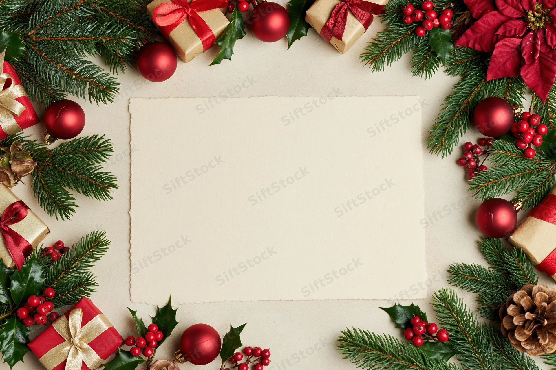 Christmas decoration border framing blank card on flat lay surface