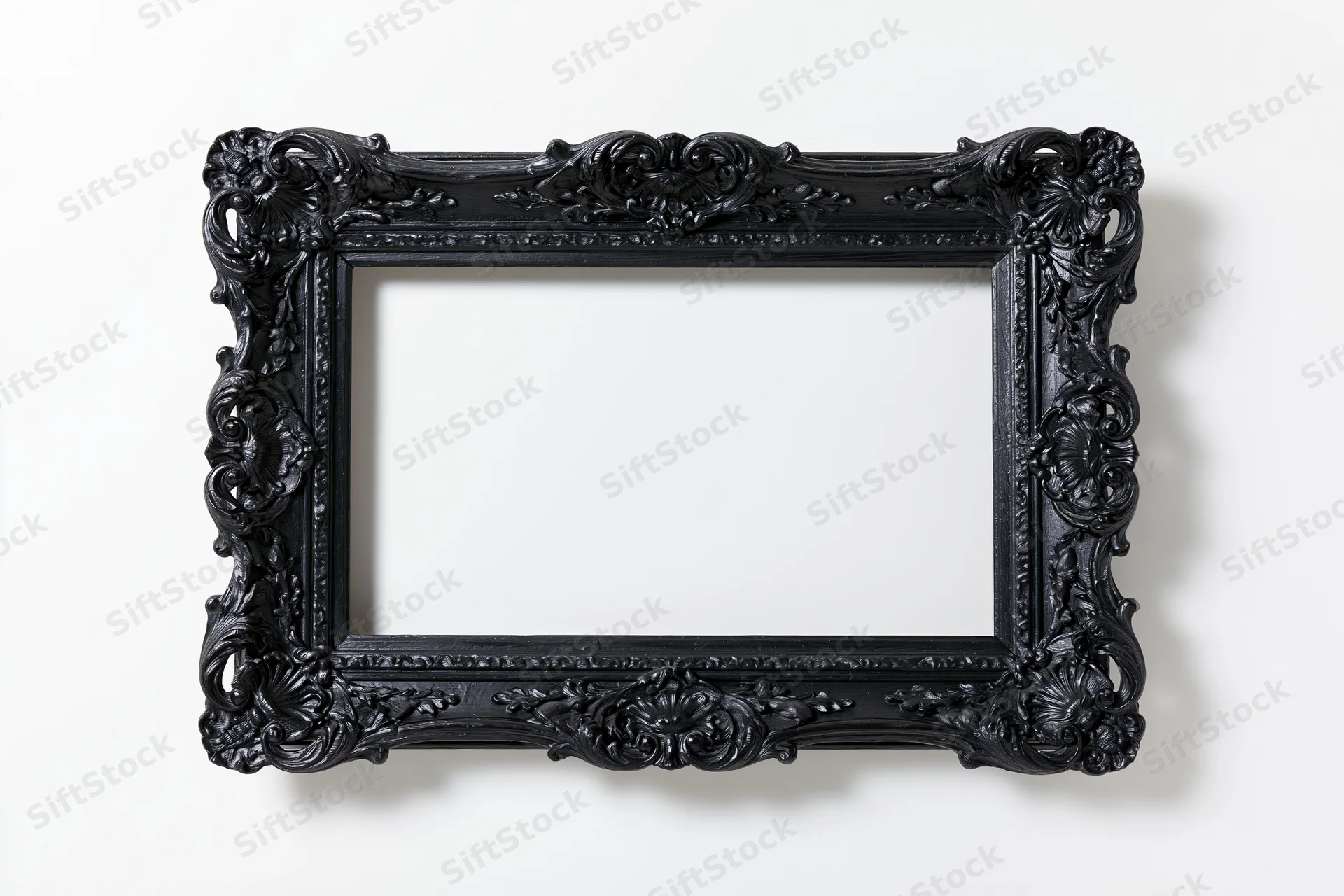 Ornate black baroque picture frame with intricate carvings displayed flat against a white background