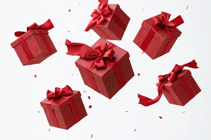 Red gift boxes with satin ribbon bows tumbling in midair against white background