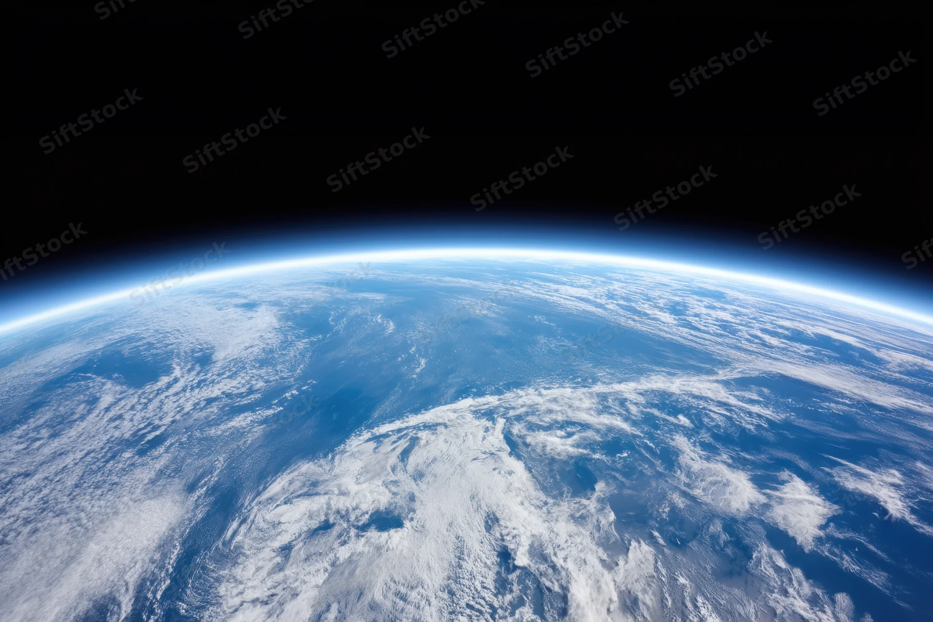 Earth viewed from orbit showing blue oceans and white clouds against black space