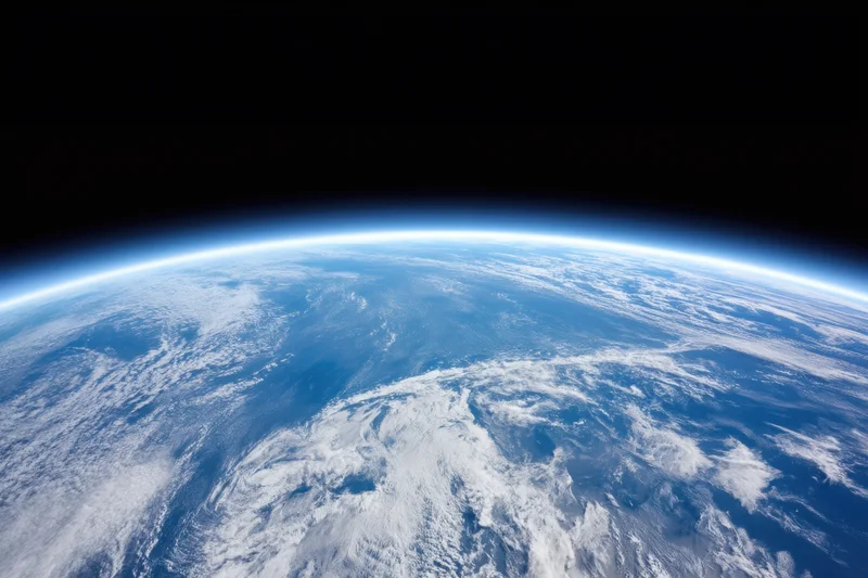 Earth viewed from orbit showing blue oceans and white clouds against black space