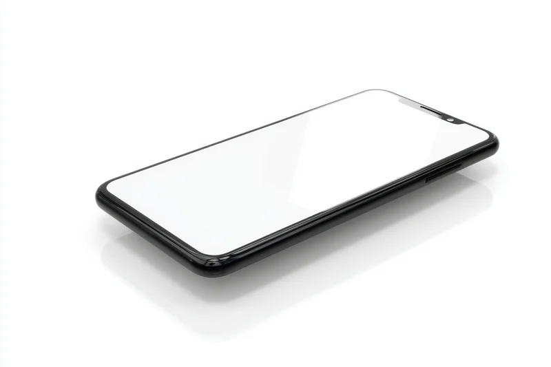 Modern smartphone with black frame and white screen lying flat on white background