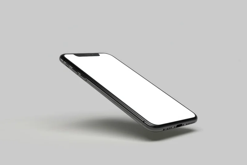 Black smartphone with white screen floating on gray background