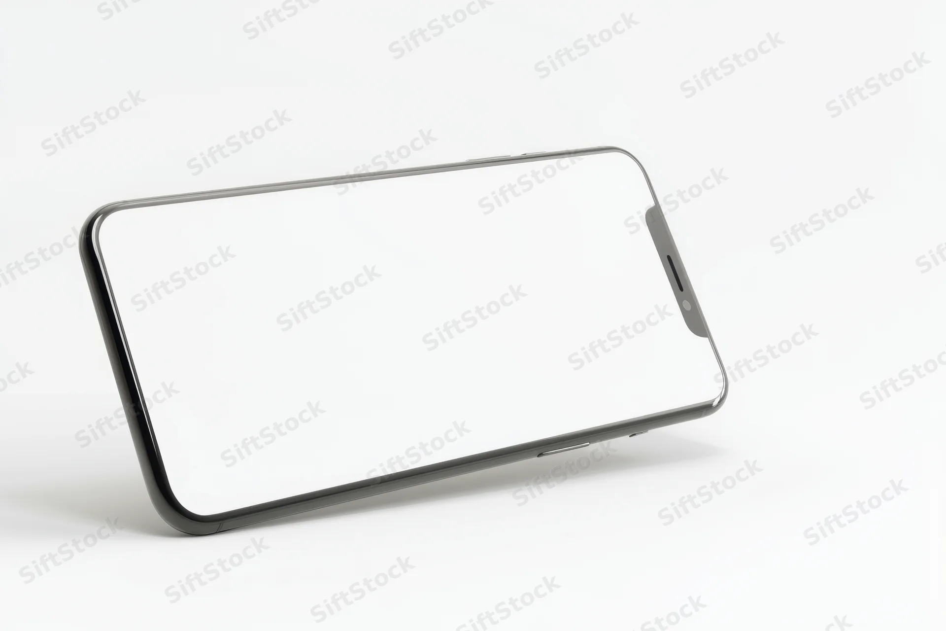 Smartphone with blank screen lying on white surface