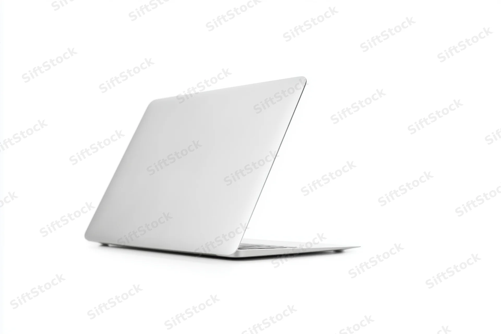 Sleek silver laptop resting closed on a white studio background with copyspace