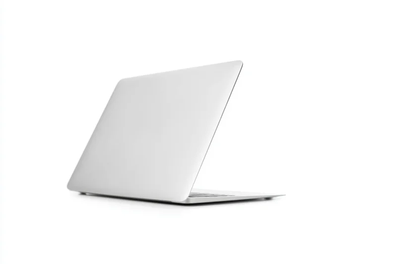 Sleek silver laptop resting closed on a white studio background with copyspace
