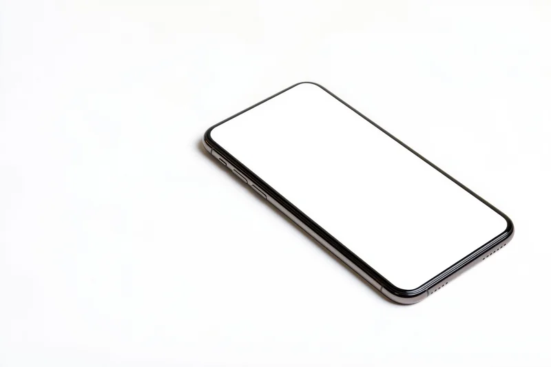 Sleek smartphone with blank white screen angled on white background