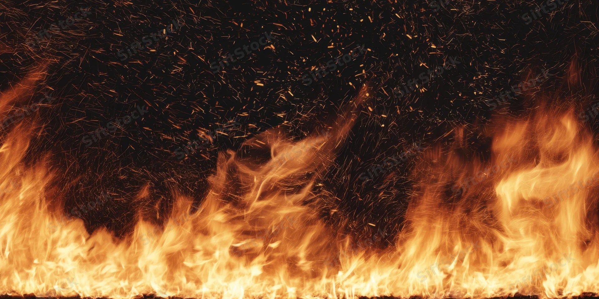 Blazing fire erupts along lower edge with orange and gold flames and rising sparks against dark backdrop
