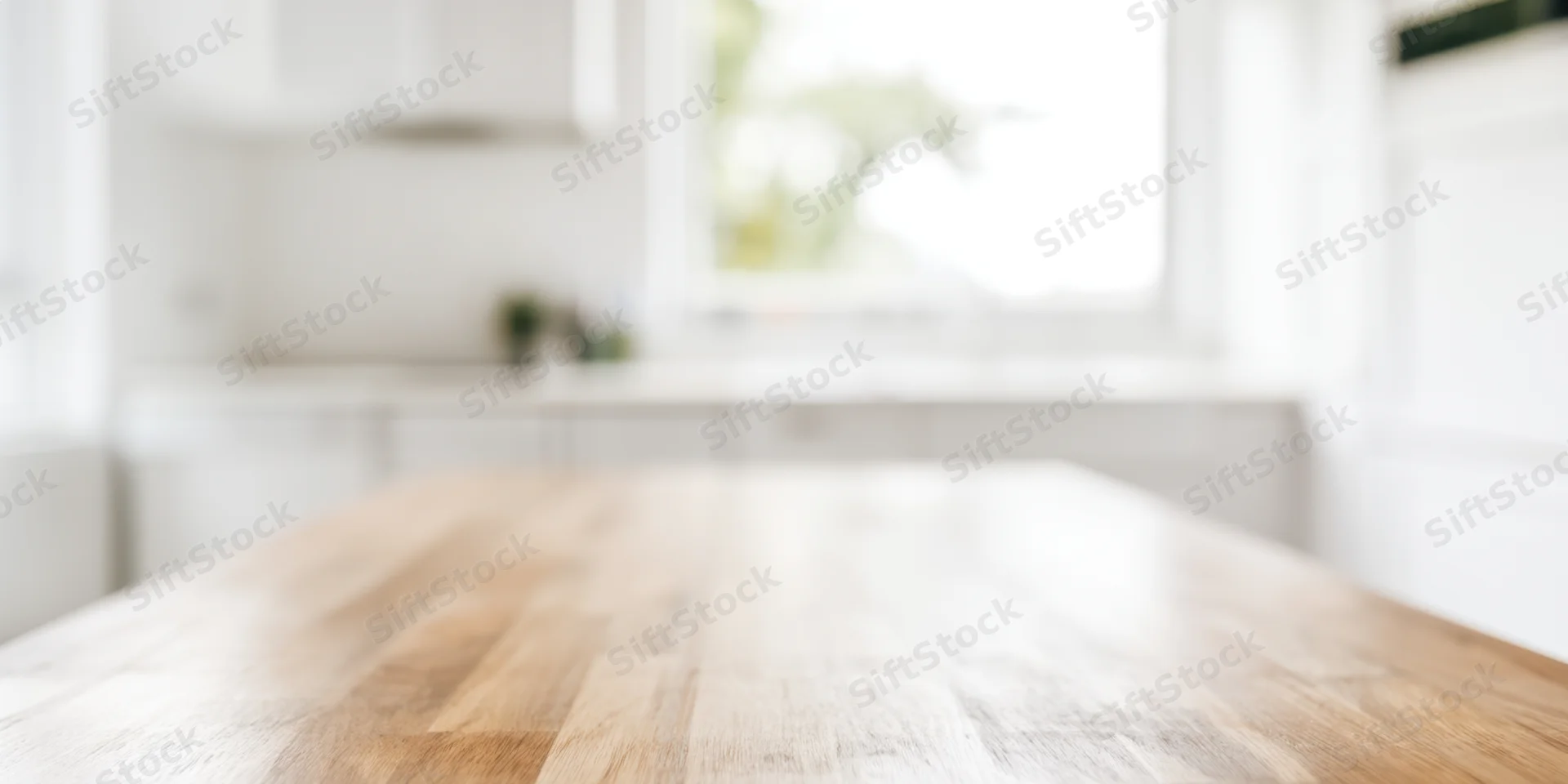 Smooth light wooden table in a bright minimalist kitchen interior