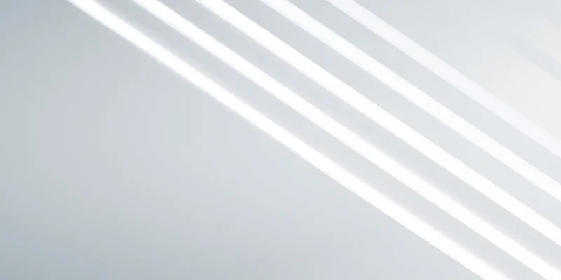 Diagonal white light stripes on a gradient gray background