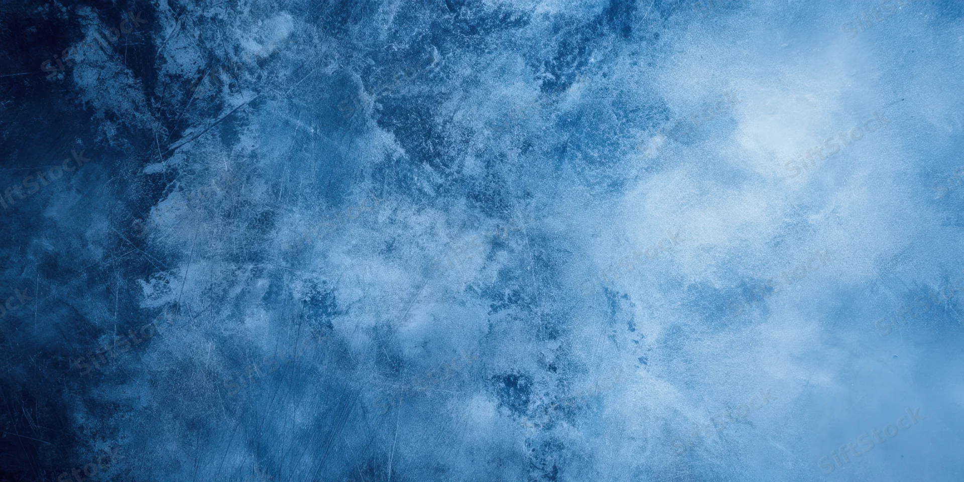 Close-up of a blue textured surface with icy marbling and weathered finish