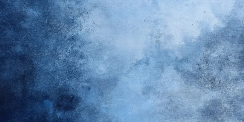 Close-up of a blue textured surface with icy marbling and weathered finish