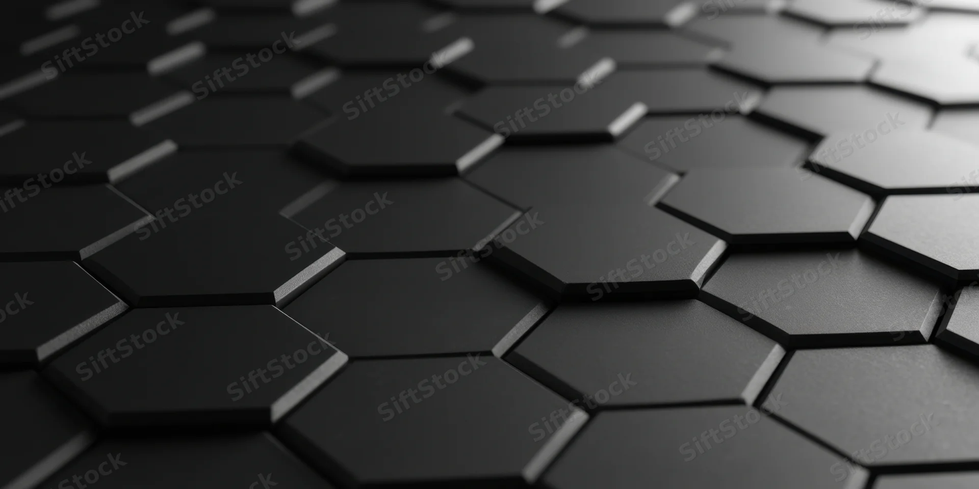 Close-up of dark three-dimensional hexagonal honeycomb pattern with matte finish and subtle lighting depth