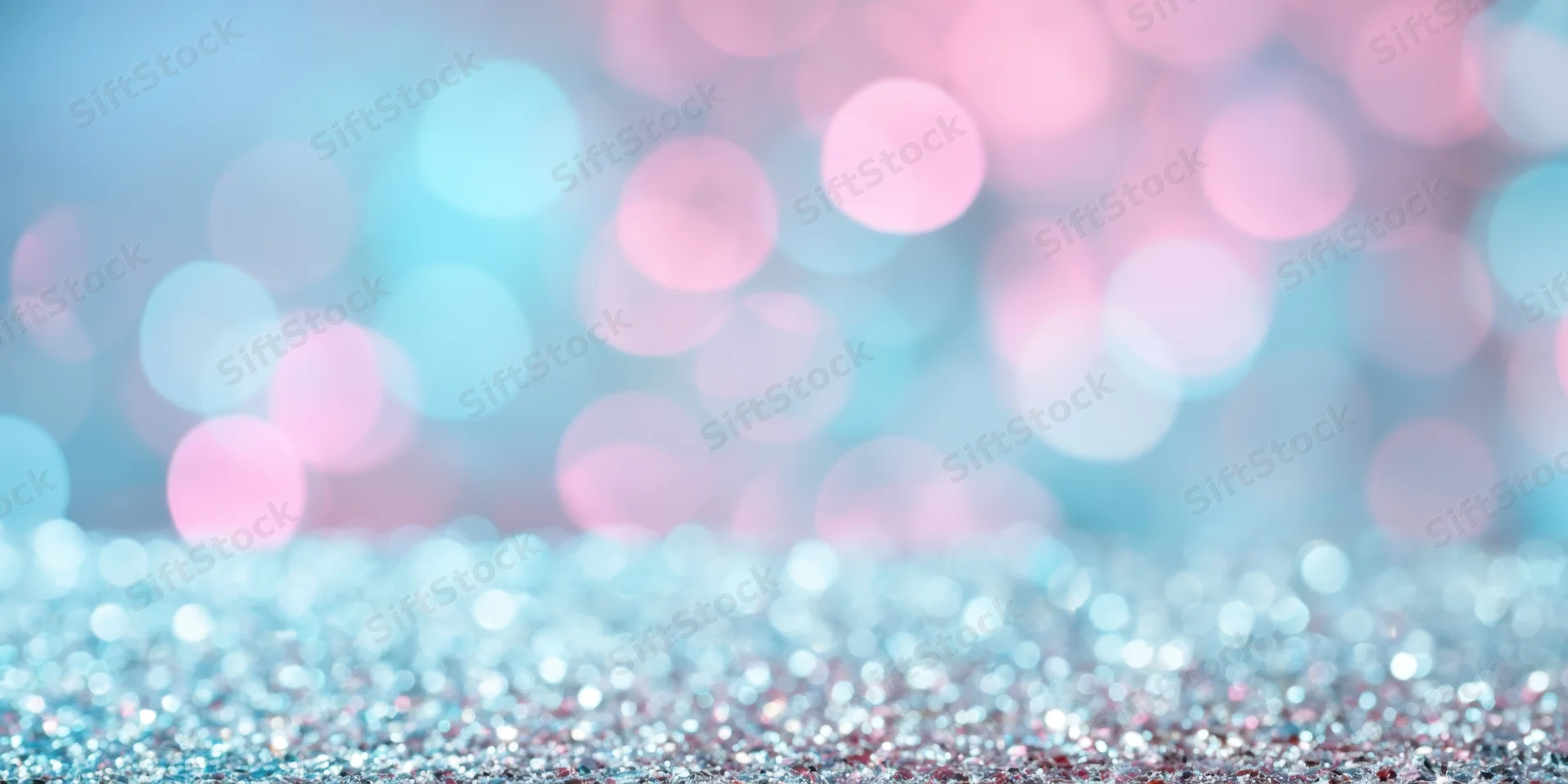 Glittering surface with tiny reflective particles under soft bokeh lighting, creating a festive abstract background with copyspace