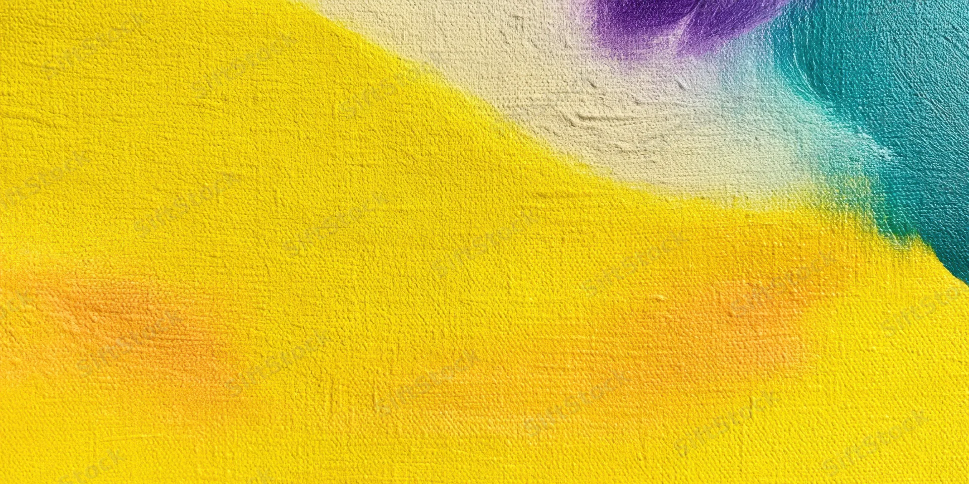 Close-up of textured canvas with bright yellow paint wash and abstract color blend