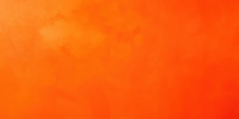 Close-up of a soft orange textured surface filling the frame