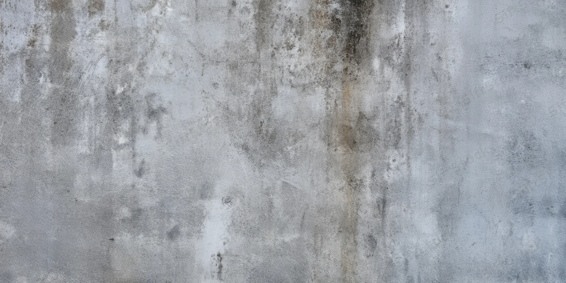 Close-up of a weathered concrete wall with subtle grime and texture