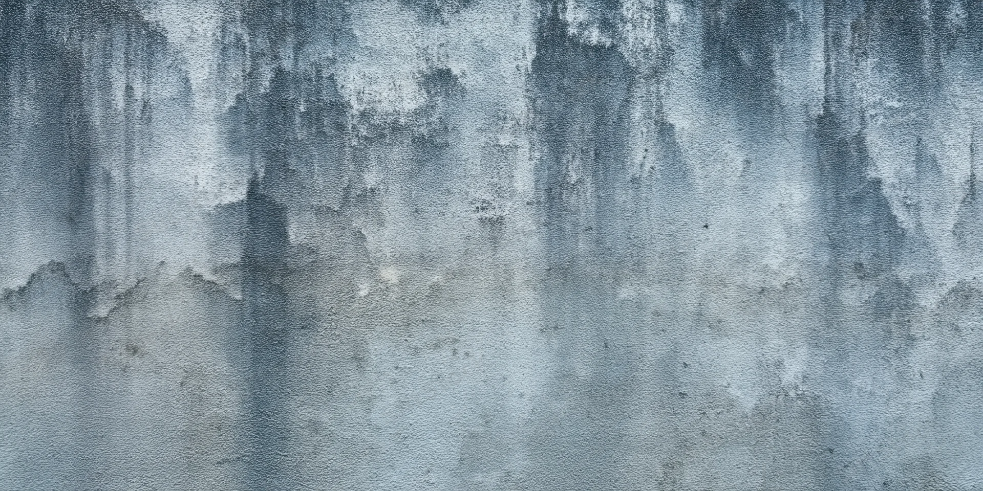 Close-up of a weathered concrete wall with subtle grime and texture