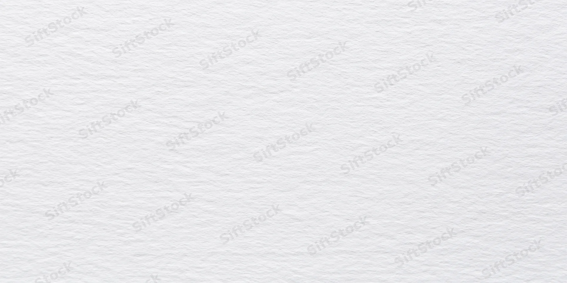 Close-up of a white textured surface with fine grain pattern