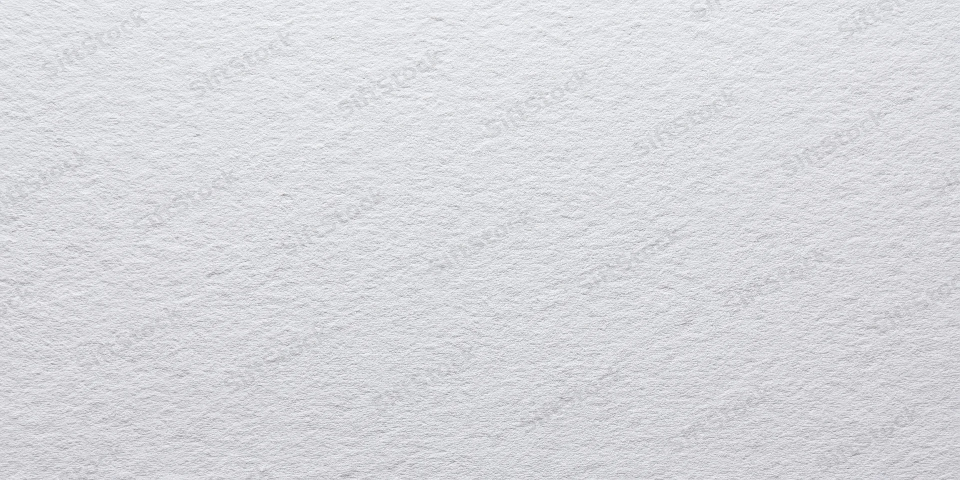 Close-up of a white textured paper surface with fine grain pattern