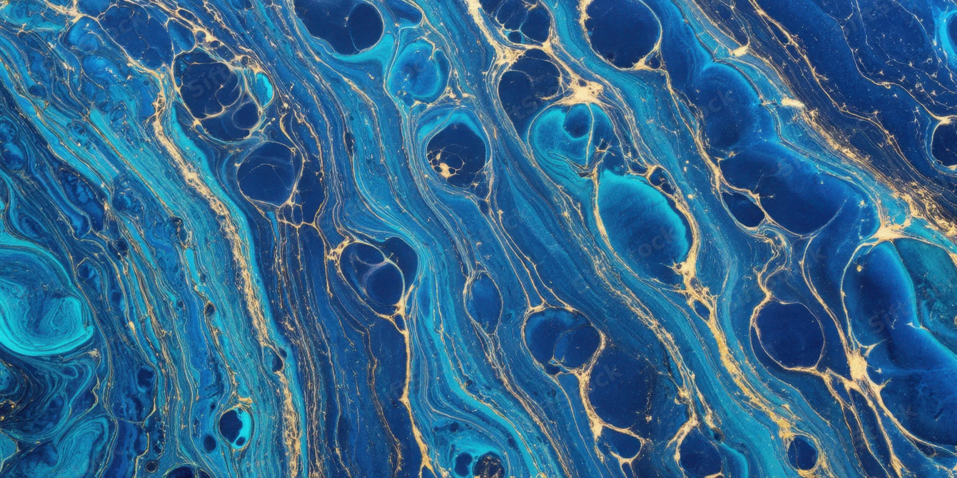 Swirling cobalt blue and turquoise marbling with gold veining across a fluid surface