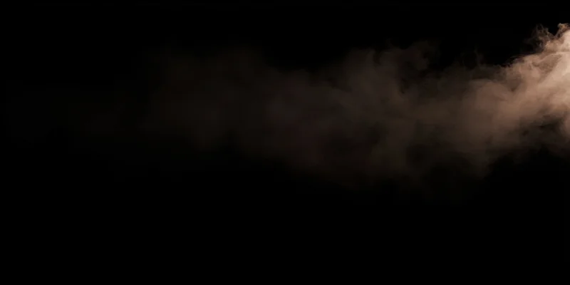 Dark plume of smoke drifting across black background