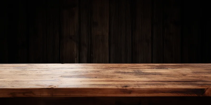 Dark seamless wooden backdrop with a warm worn light wood top