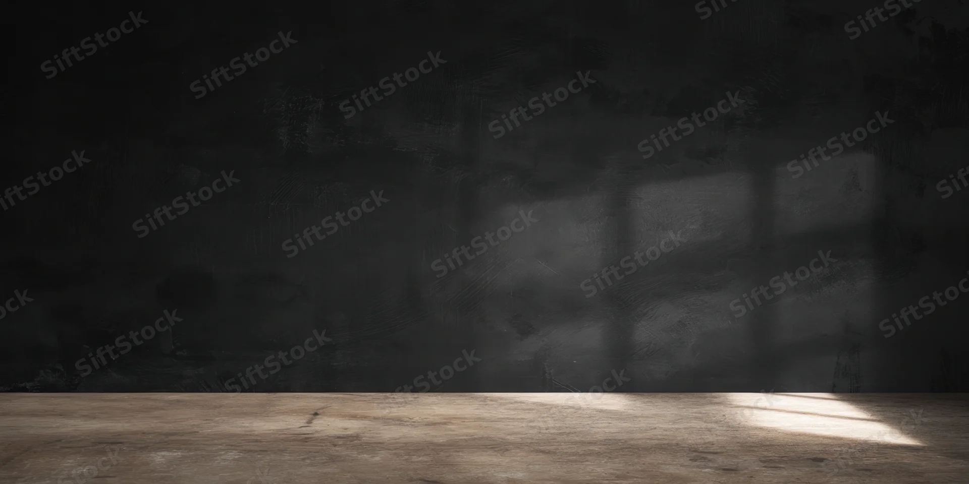 Dimly lit studio interior with rough black textured wall and wooden floor showing window shadow pattern
