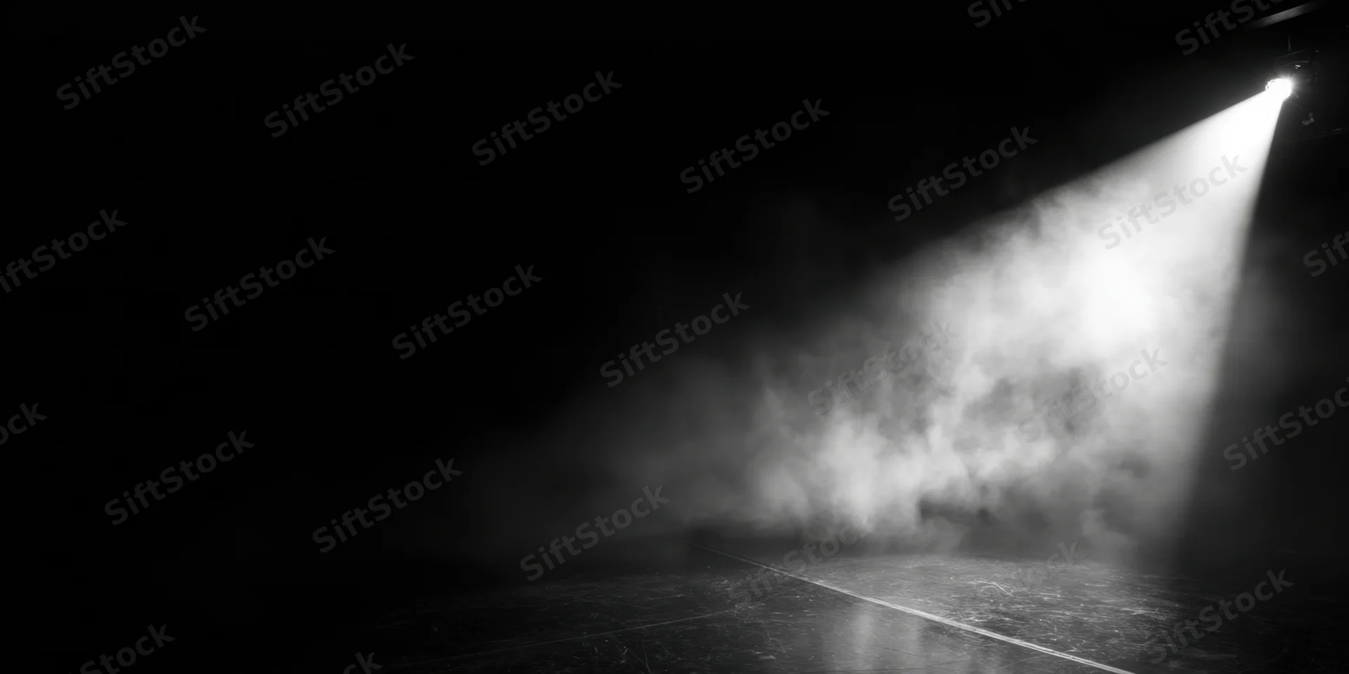Single spotlight beam cutting through smoke on an empty stage floor