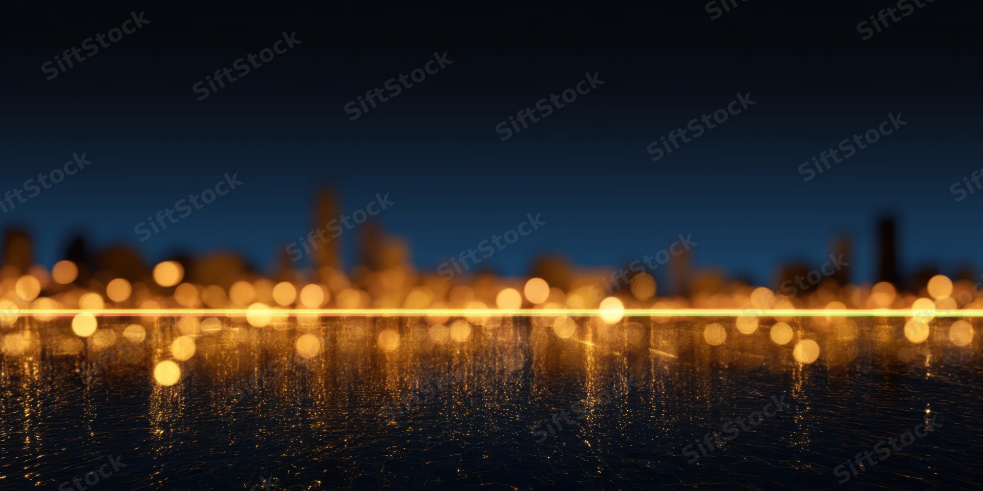 Blurred city lights reflecting on water at night