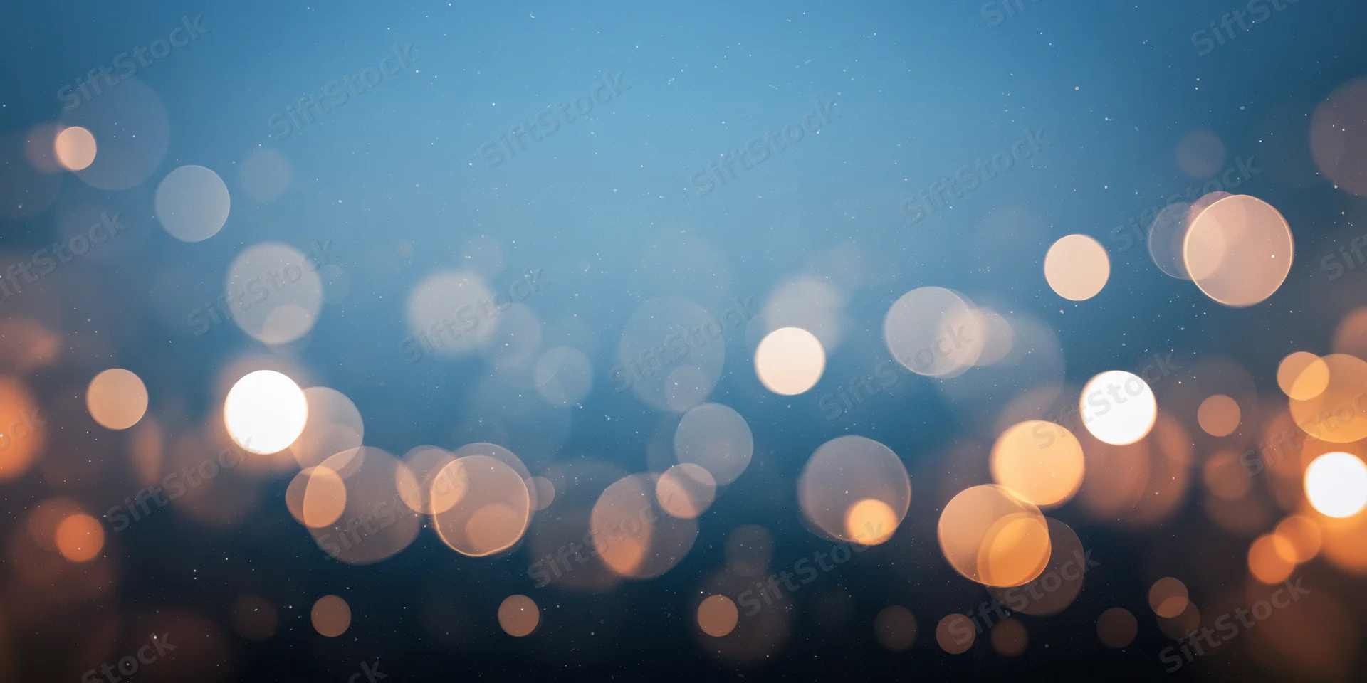 Soft bokeh lights in warm orange and white tones over a blue gradient background