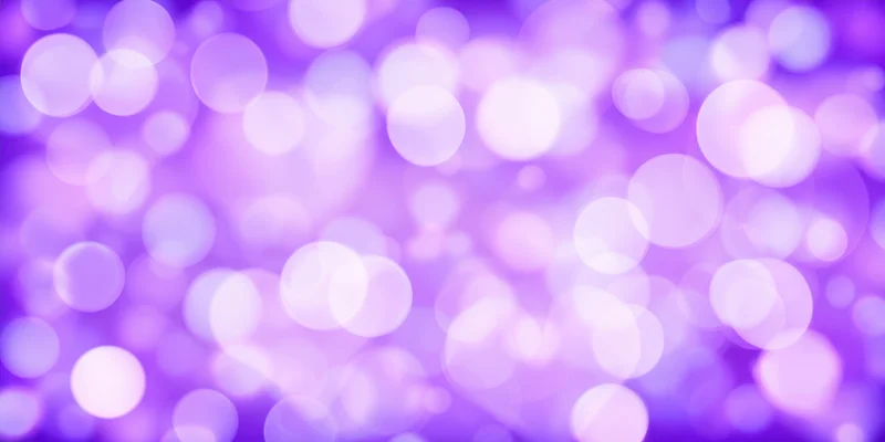 Soft glowing purple bokeh circles forming a dreamy abstract background