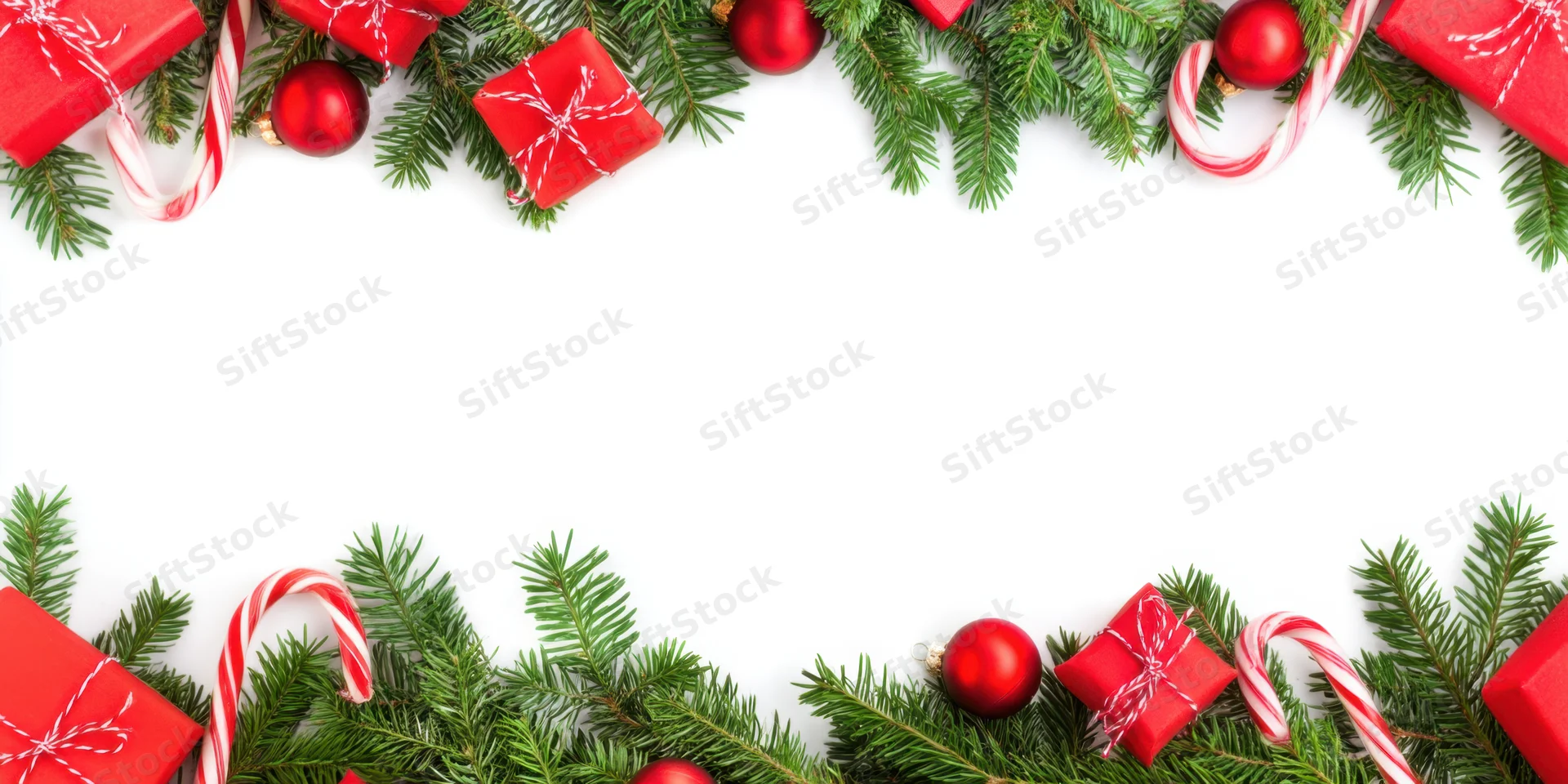 Christmas border of evergreen branches with red gifts and candy canes on white background