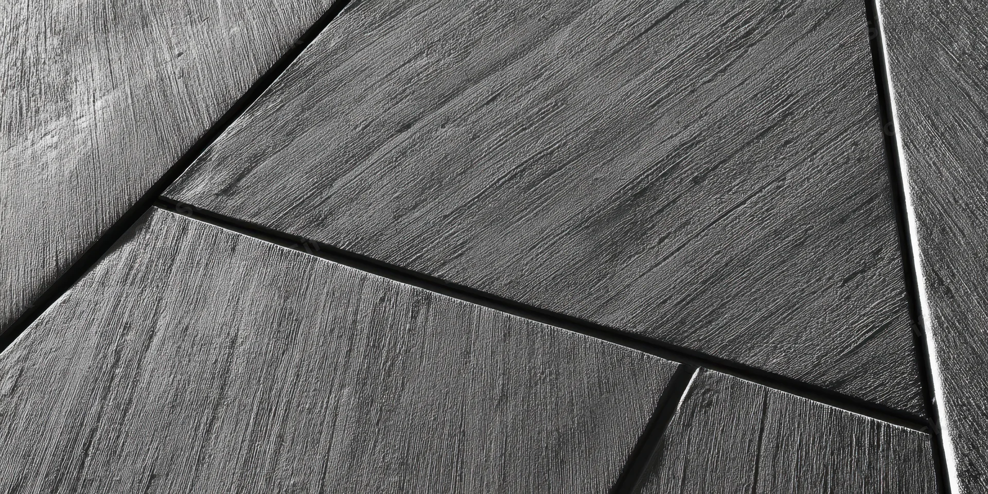 Diagonal concrete panels forming geometric pattern on a wall surface