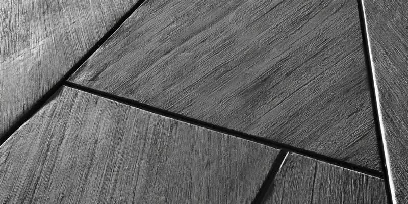 Diagonal concrete panels forming geometric pattern on a wall surface