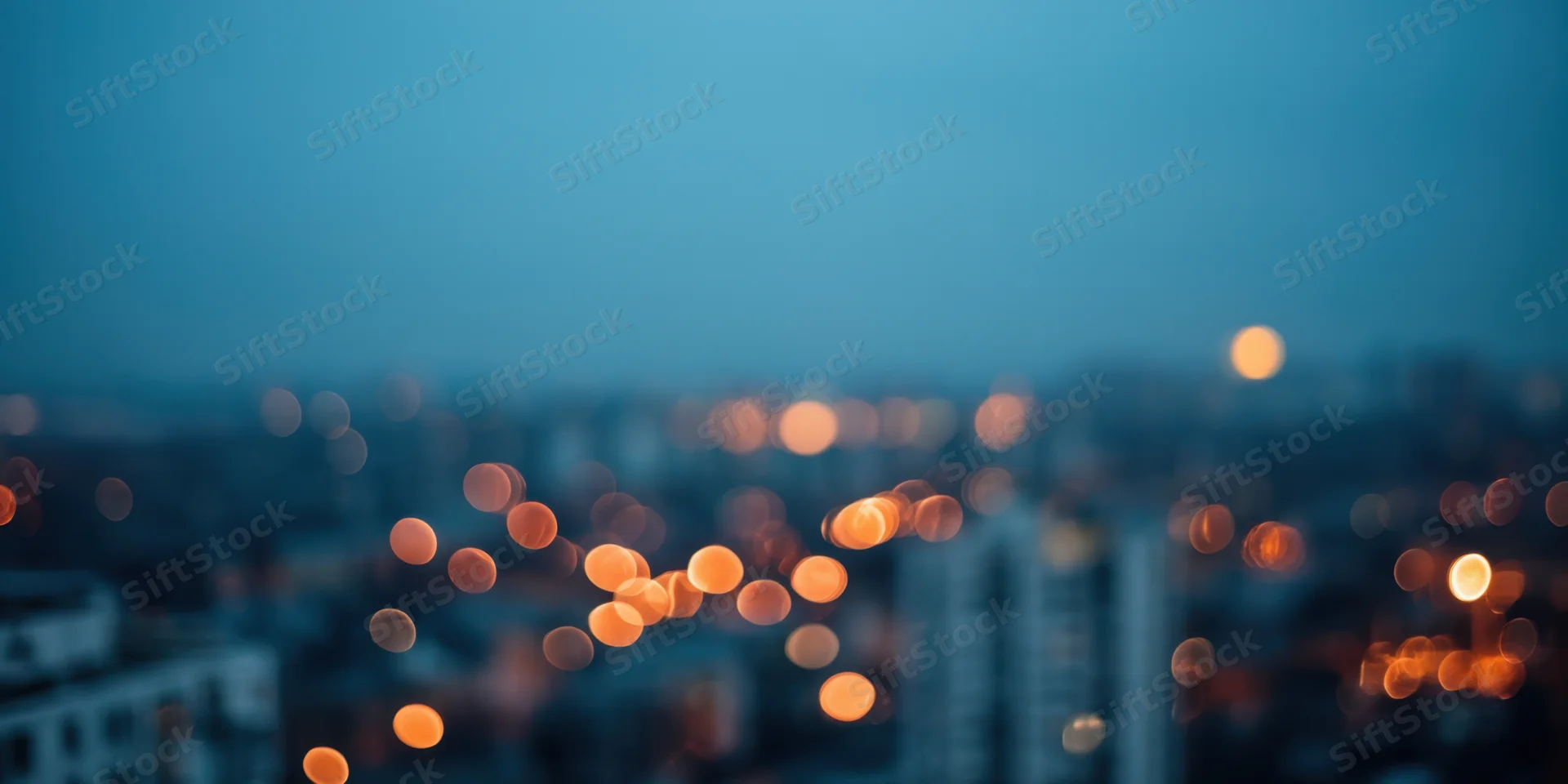 Blurred city lights at night with soft bokeh effect and hazy atmosphere